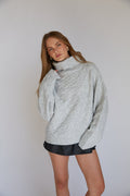 Pull col roulé en tricot torsadé August