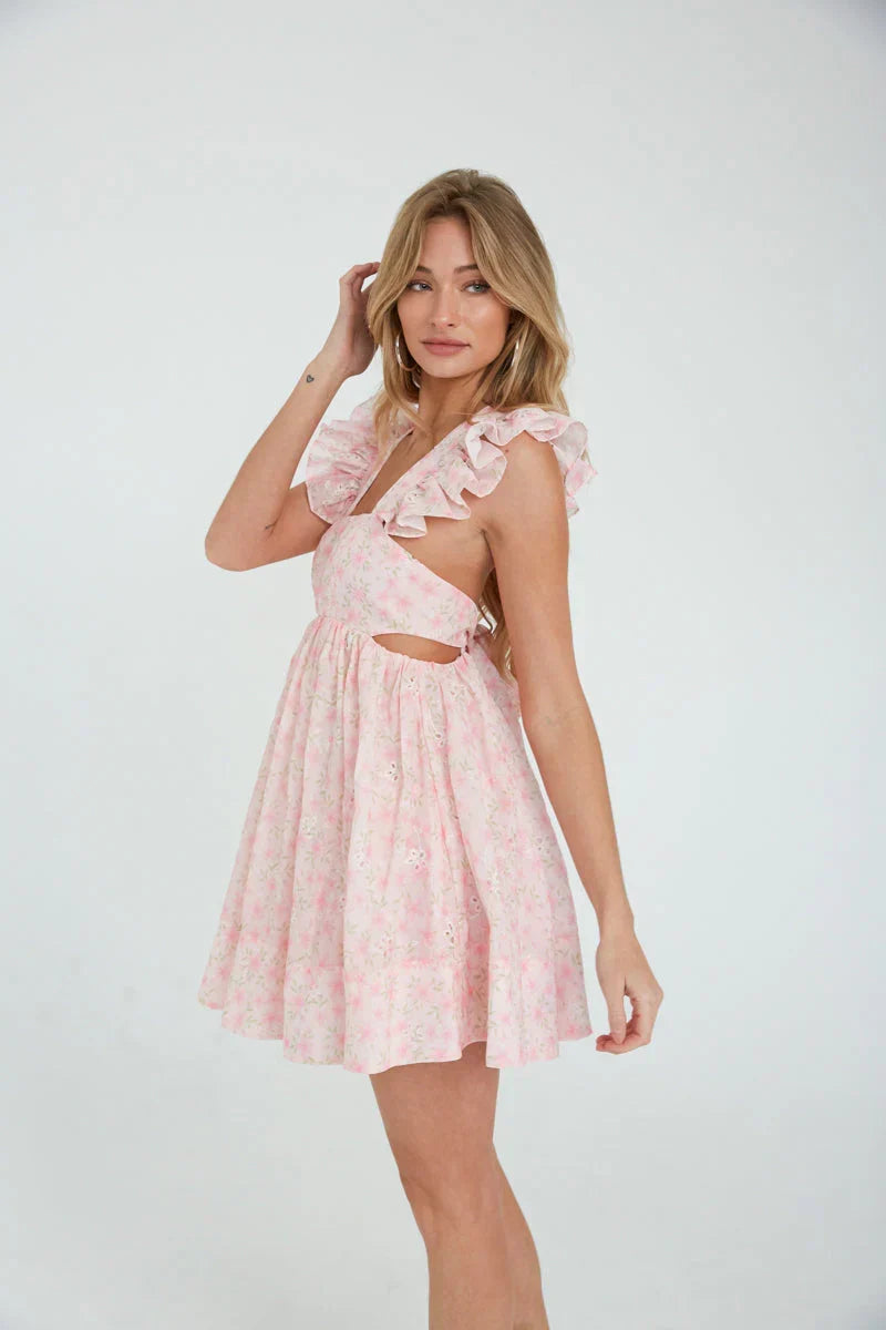 Mini-robe babydoll Cara à œillets fleuris et manches papillon