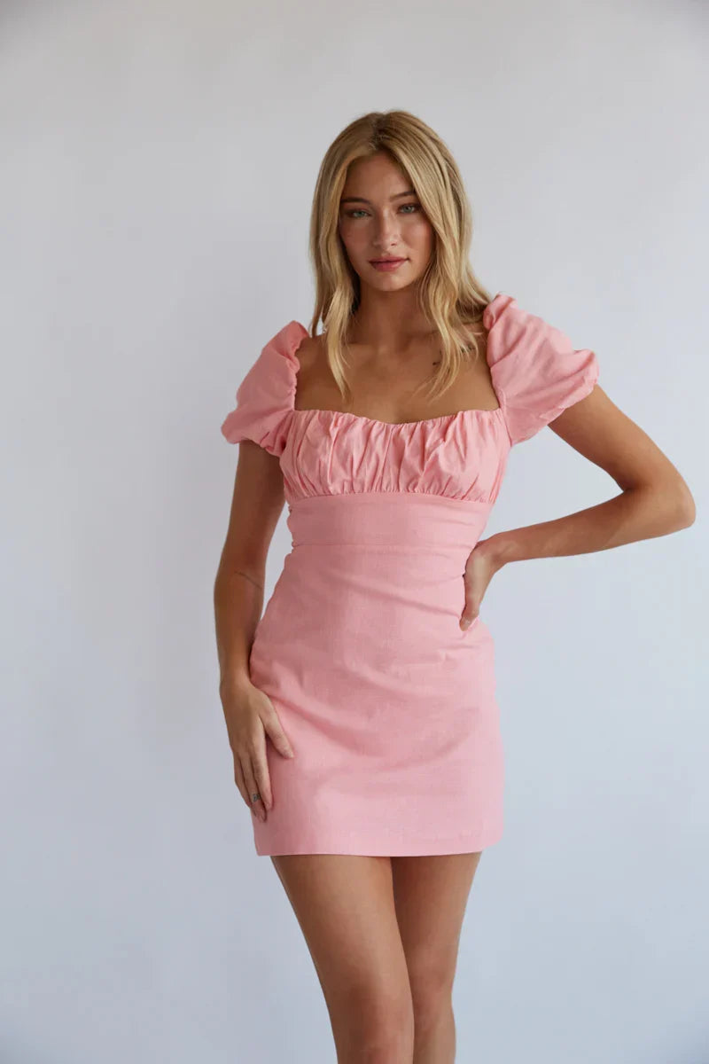 Mini-robe Emma à manches bouffantes et dos ouvert