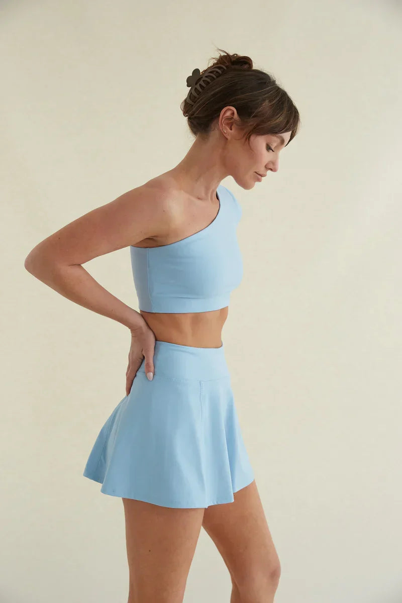 Haut court asymétrique Mia Smoothing bleu